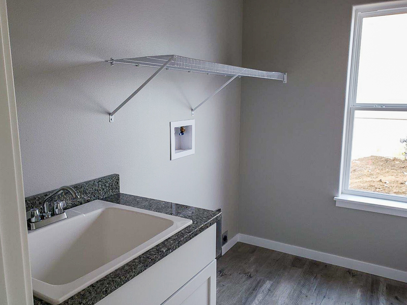 Apex Construction Iowa City IA New Home 110 Cherry Lane Riverside Iowa laundry room